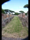 00655 ostia - regio ii - decumanus maximus - regio ii - insula ii - portico del tetto spiovente (ii,ii,6) - ri osten - 2014.jpg